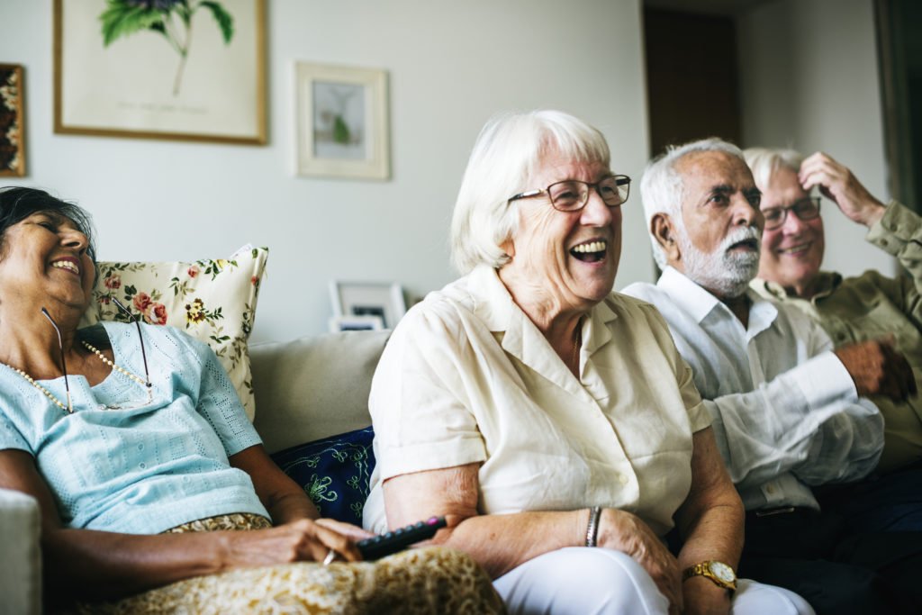 Care community enjoying television together